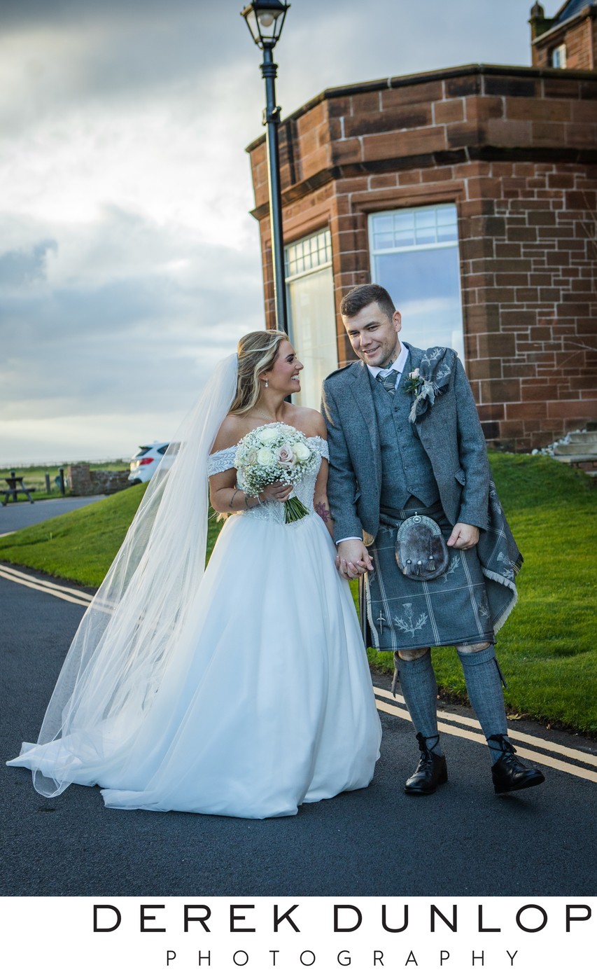 Bride and groom outside Marine Troon hotel