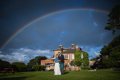 rainbow over Mabie house hotel wedding photo