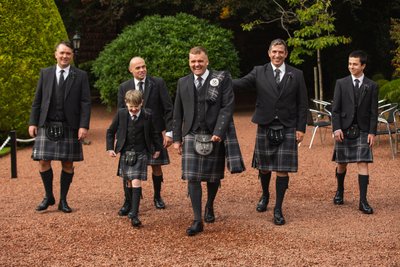 Groomsmen walking Brig o Doon gardens