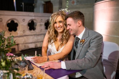 signing for the newly married couple in cottiers 