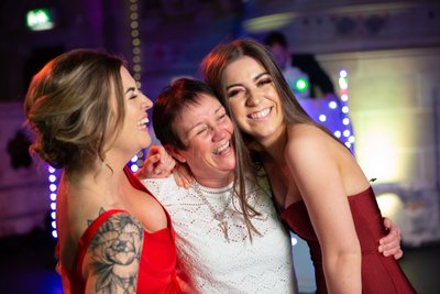 Guests laughing on dance floor - Cottiers wedding