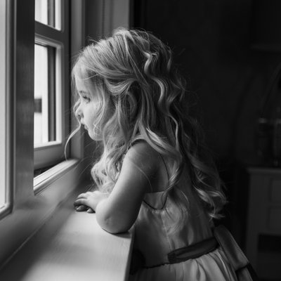 black and white wedding photo, child daydreaming
