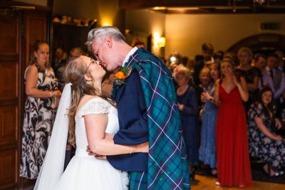 Kiss at first dance in piersland house wedding venue