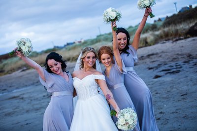 Bridesmaids celebrating Troon beach wedding