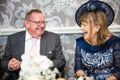 Parents of the couple laughing Marine Troon