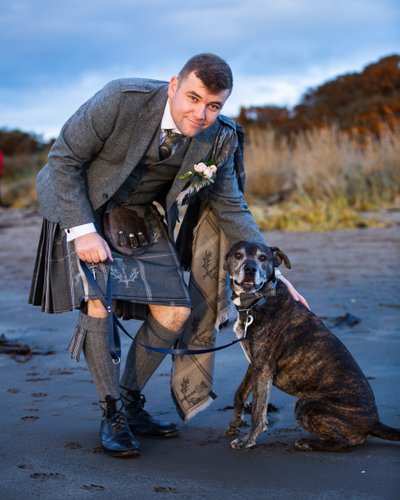 Groom and dog Troon beach wedding