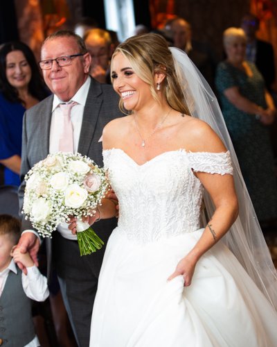 Bride and father walking down the aisle Marine Troon