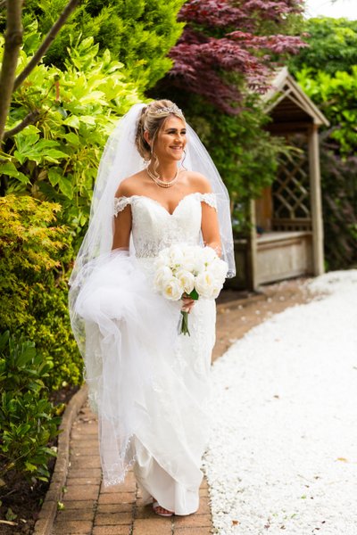 Bride walking at her wedding at Fairfield house hotel