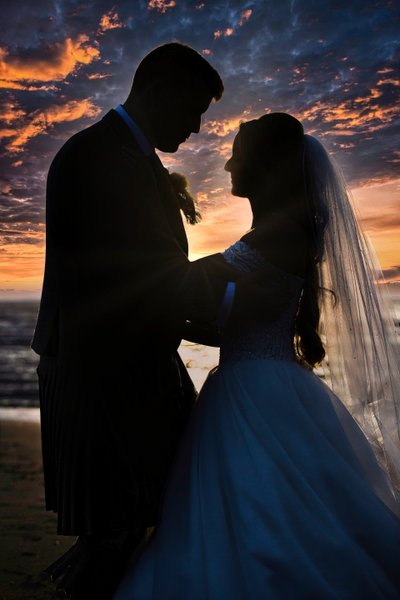 Sunset silhouette wedding couple Troon beach