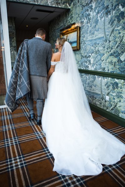 Couple walking tartan carpet Marine Troon