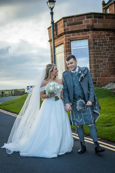 Bride and groom outside Marine Troon hotel