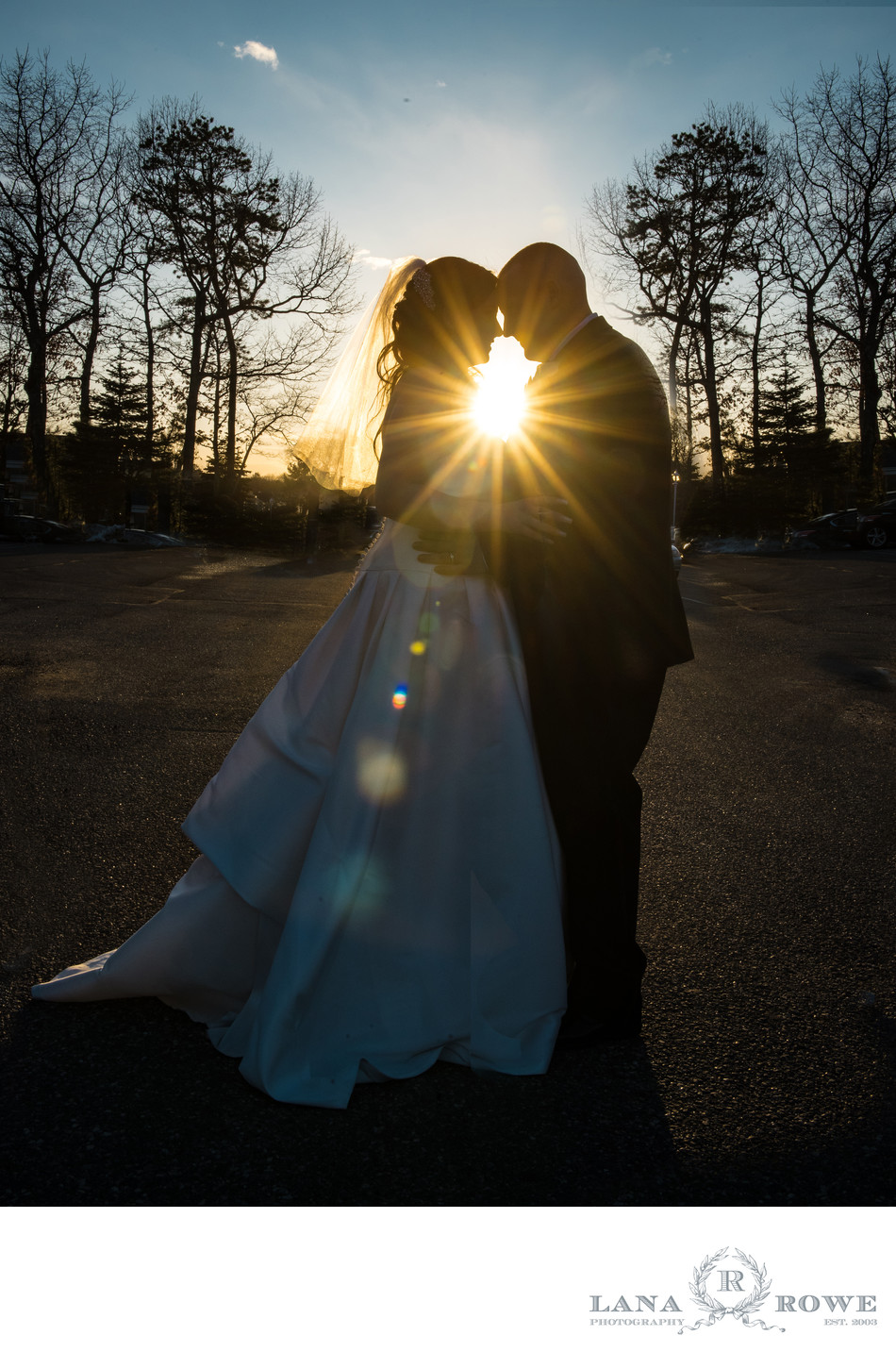 Bride and Groom at Sunset with star burst flare