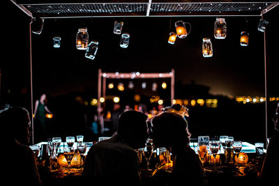 Lit-up Mason Jars Above Kiss