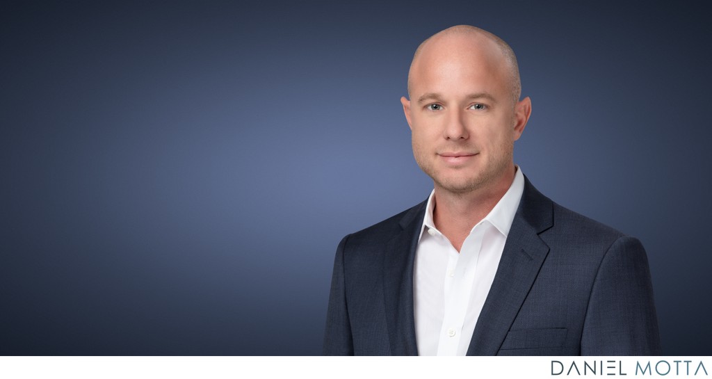 Trustworthy Blue Background Headshot for Professionals in Dallas