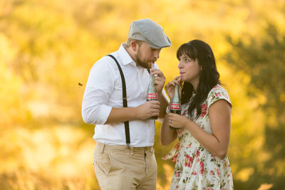 40's Themed Engagement Couple Sip Coca Cola