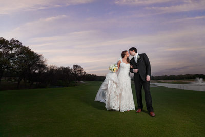 Wedding Photography of Newlywed Couple Kissing 