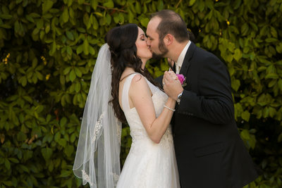 McKinney Couple Share Kiss Outdoors at Bingham House