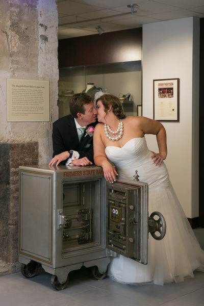 Dallas Newlywed Couple Kiss at Higginbotham Building