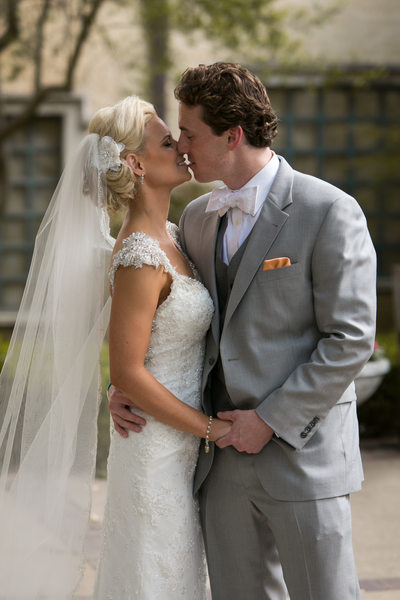 Dallas Bride and Groom Kiss During 1st Look at Wedding
