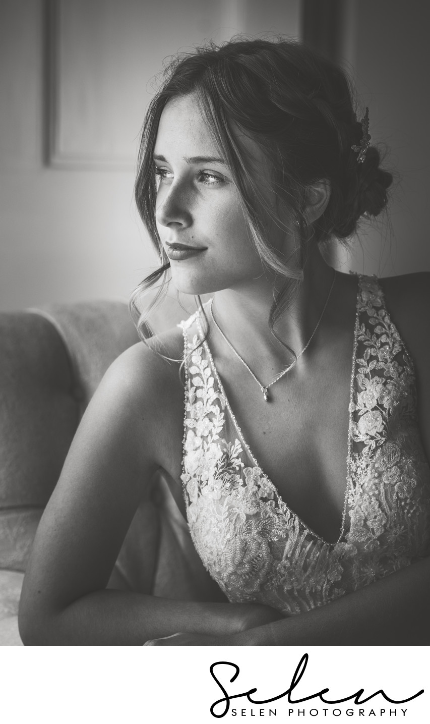 Bride looking out of the window, natural light photo