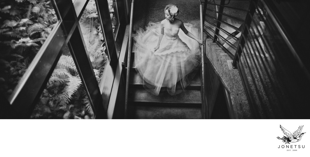 Bride in Lazaro gown on stairs Brentwood Bay Victoria