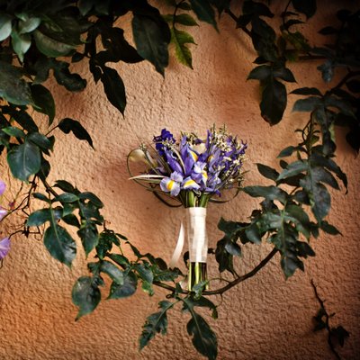 Bridal bouquet photographed on natural vines and purple