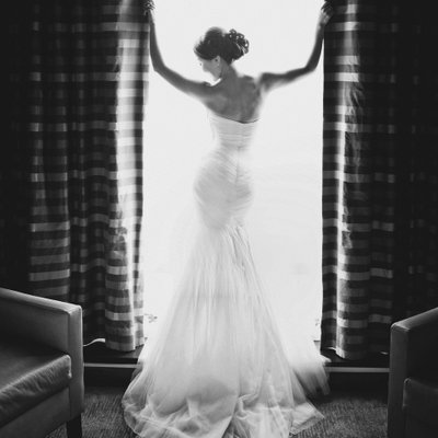 Luxury bridal gown portrait of bride in hotel room 