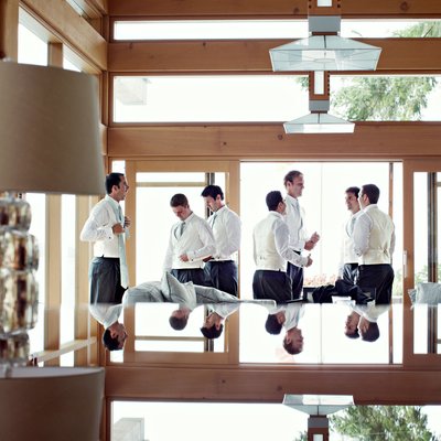 Bridal party groomsmen getting ready reflection