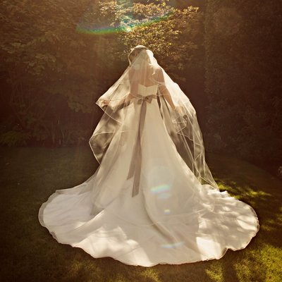 Vera Wang bridal portrait with veil backlit Vancouver