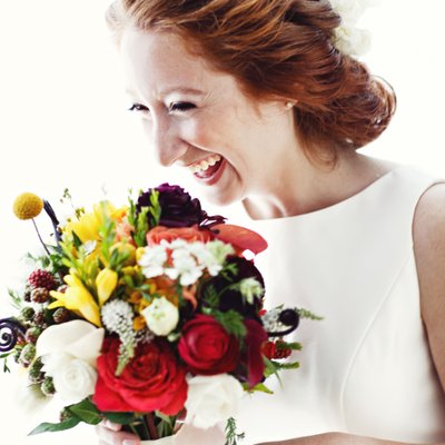Bridal portrait with bright bouquet at Jewish wedding 