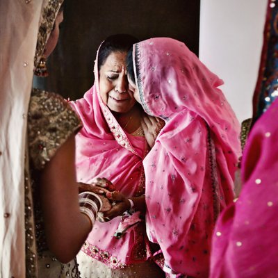 Mothers of Indian bride and groom share special moment