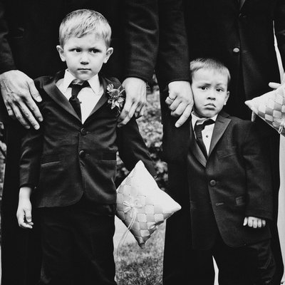 Ring bearers with ring pillows during ceremony
