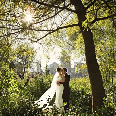 Vancouver wedding portrait with city and forest backlit