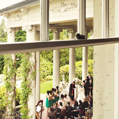Hycroft wedding ceremony on portico from window