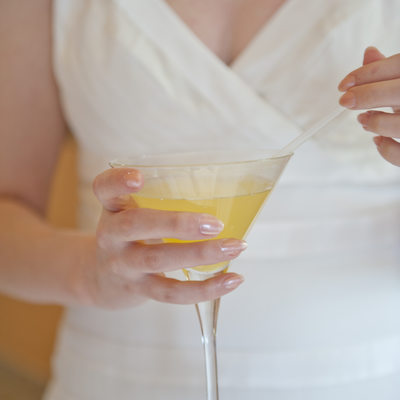 Bride holding Fruity Drink at Wedding