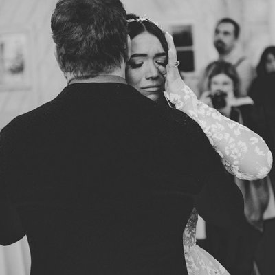 Bride Wipes a Tear During Dance with Dad