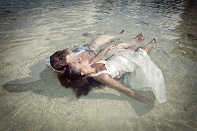 Couple Lying in Ocean at Jamaica Wedding