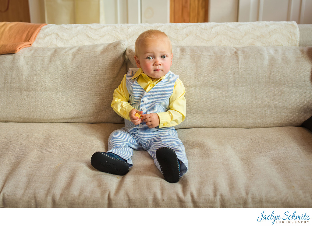 Cute little boy in yellow and blue suit
