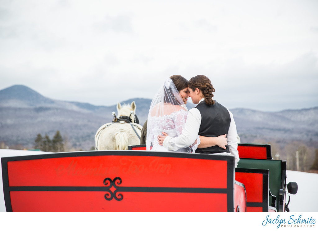 Horse drawn carriage winter wedding Vermont