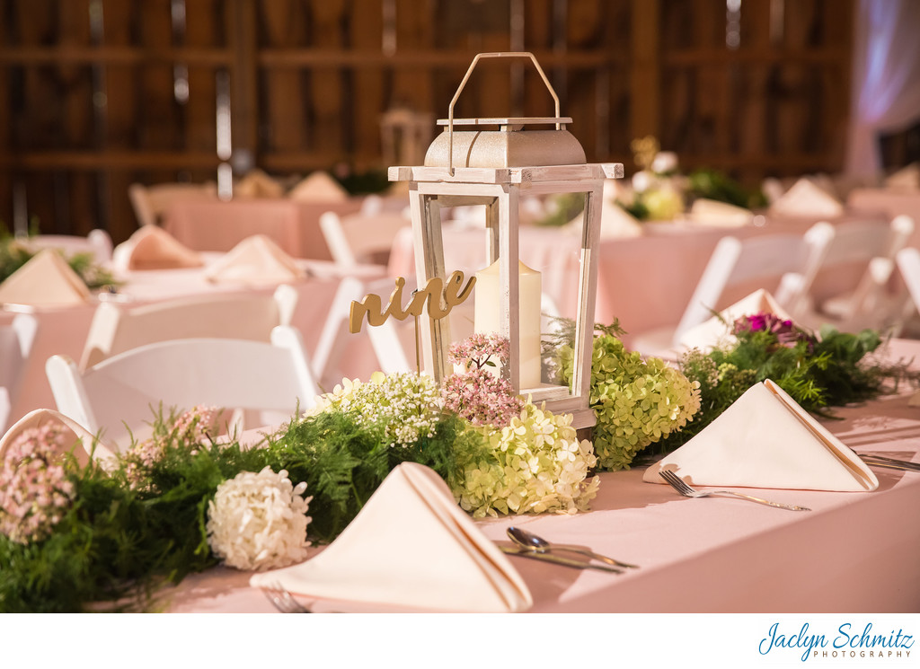 white lantern and table greenery wedding decor