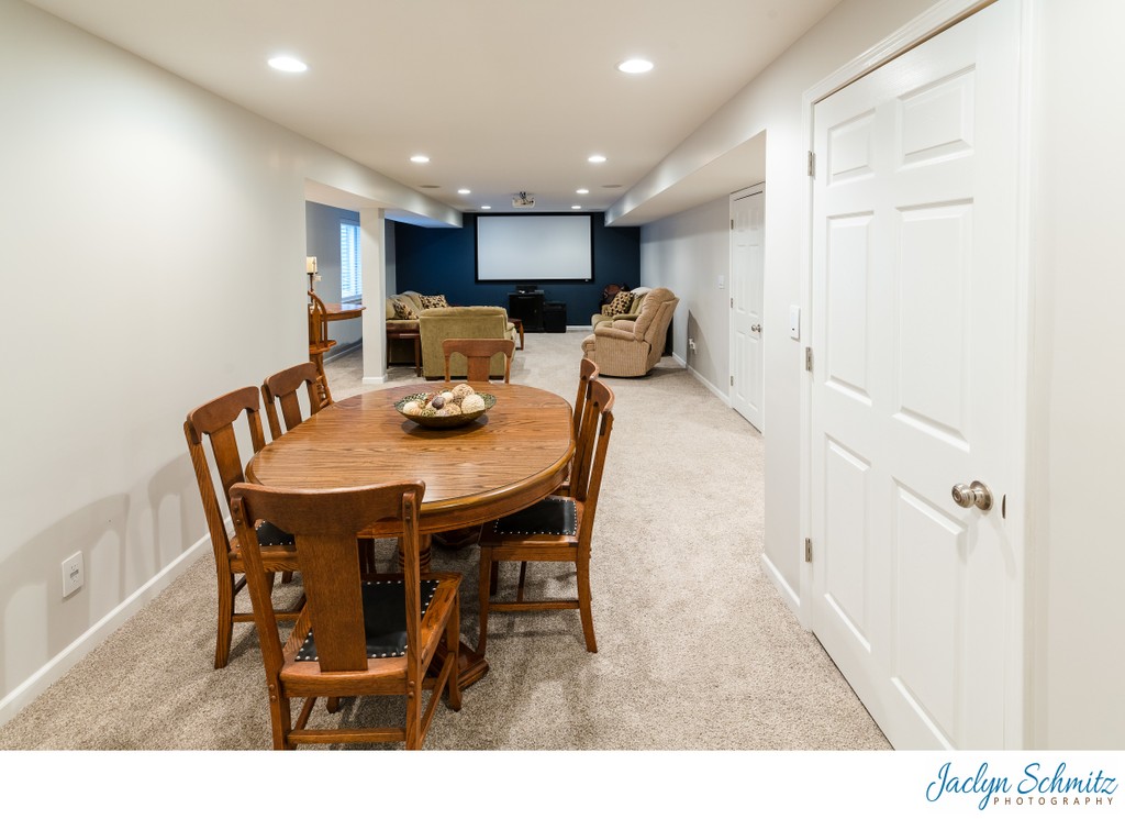 Card table and movie room in basement