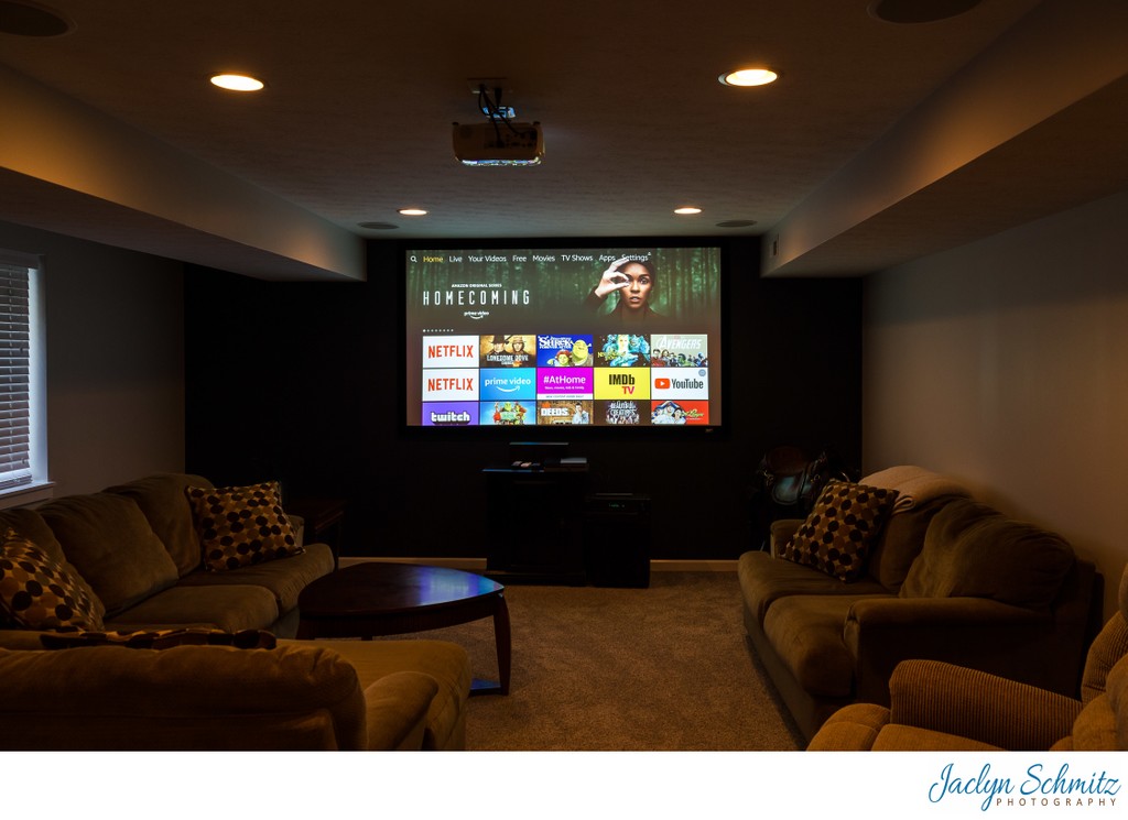 Basement tv room with movie theater lighting