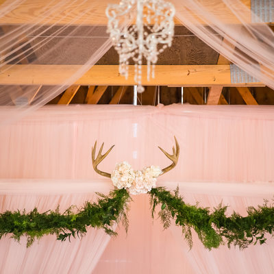 Romantic deer antler wedding ceremony decor