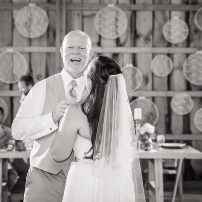 Laughing father of the bride first dance