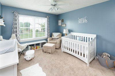 Blue baby nursery real estate photo