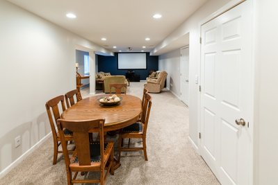 Card table and movie room in basement
