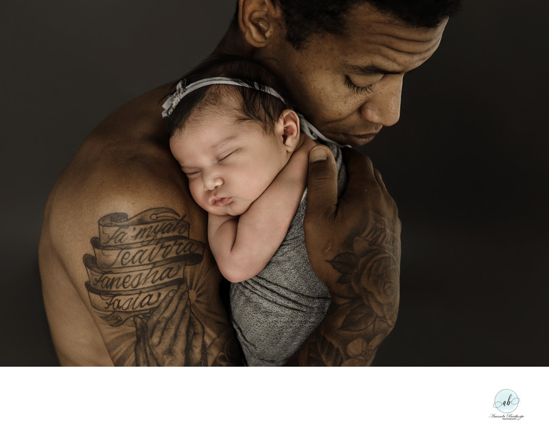 newborn daughter and father portrait