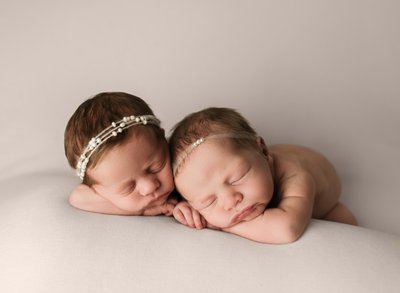Twin newborn girls. Posed twin newborn photography.