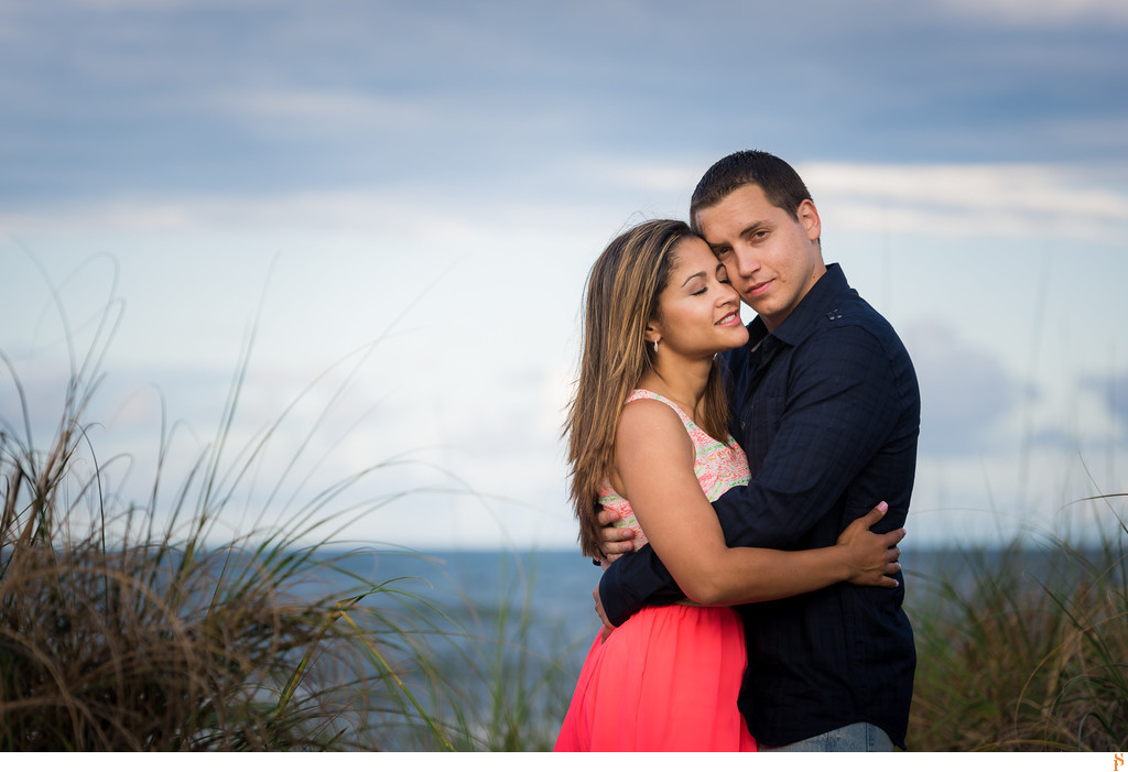Engagement Photos at the Jacksonville Beach with a pink dress