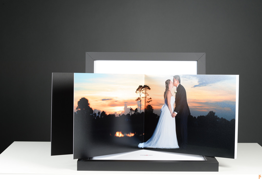 SUNSET BRIDE AND GROOM PHOTO IN A WEDDING ALBUM WITH A BACK BOX